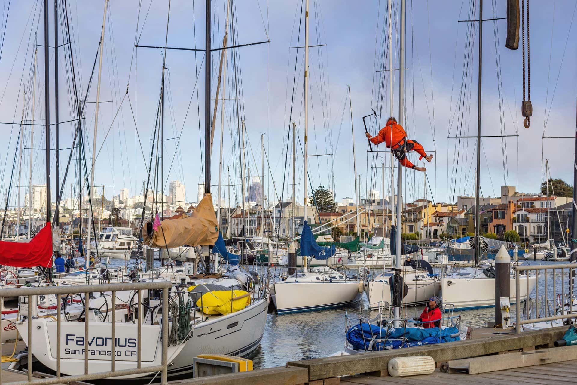 Marina service technicians working on sailboats for the Atlantis Marina service marketplace