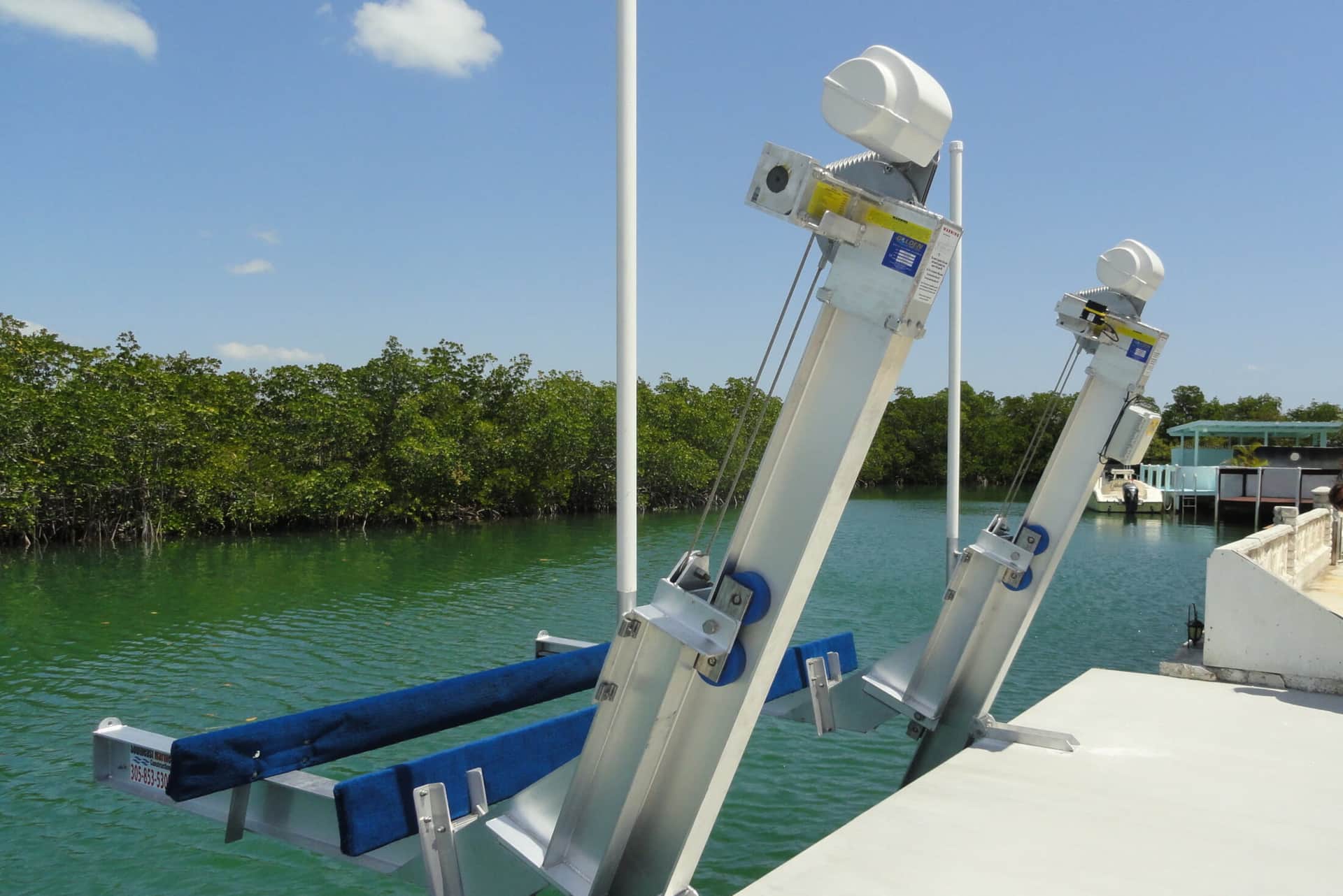Dockside smart boat lift hardware connected to Atlantis Marina